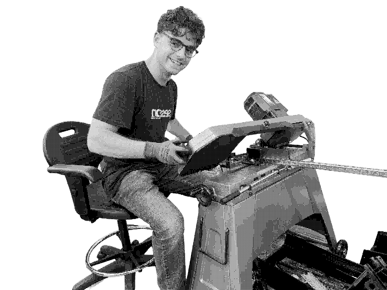 Alex working at a lathe in the workshop